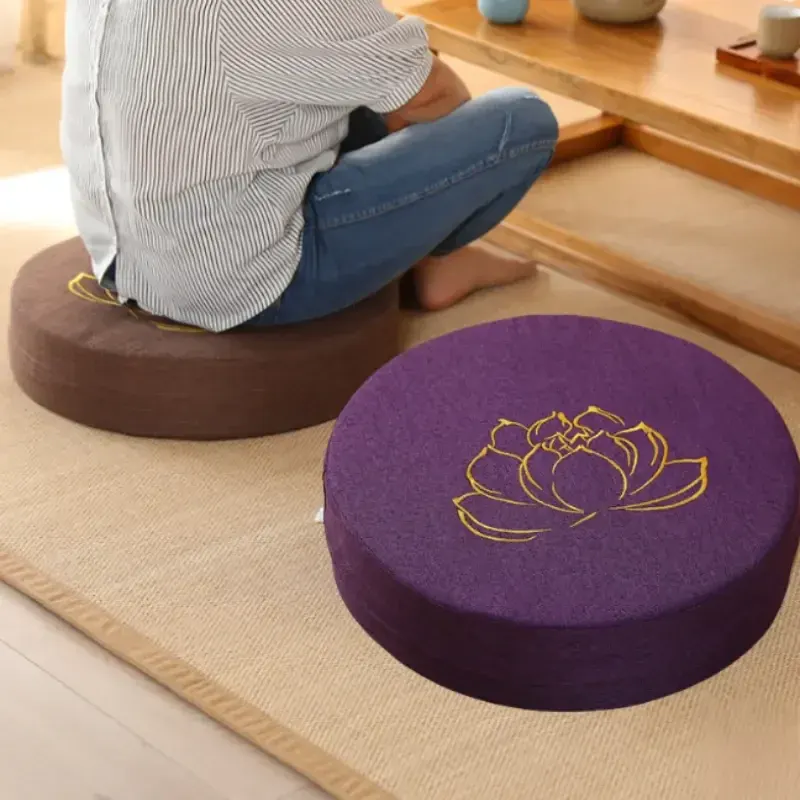 Person sitting cross-legged on a StillSeat meditation cushion