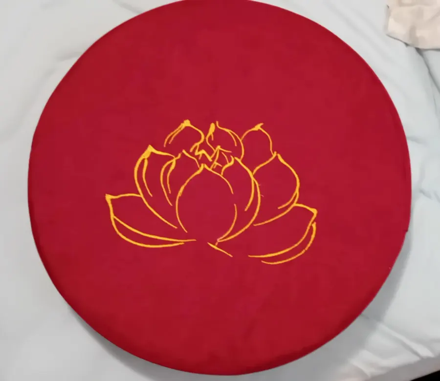 Bright red meditation cushion photographed at home by a verified buyer
